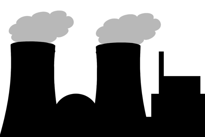 silhouetted nuclear power plant